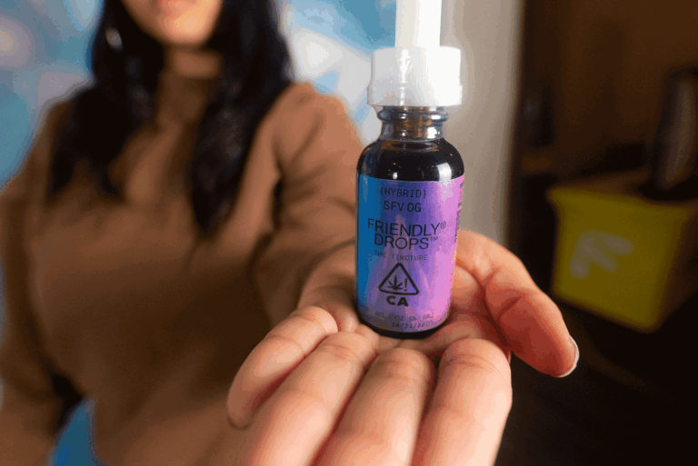 Woman holding Friendly Drops cannabis tincture